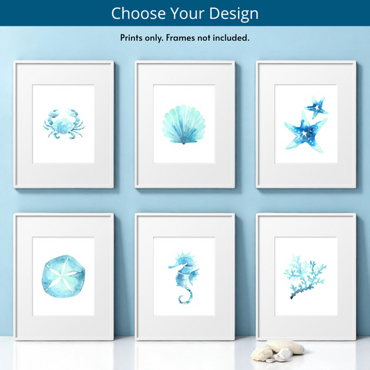 Full collection of six 8x10 beach-themed art prints displayed together, featuring starfish, seashell, seahorse, sand dollar, coral, and crab designs—each framed and styled to show the variety of coastal wall art available individually.