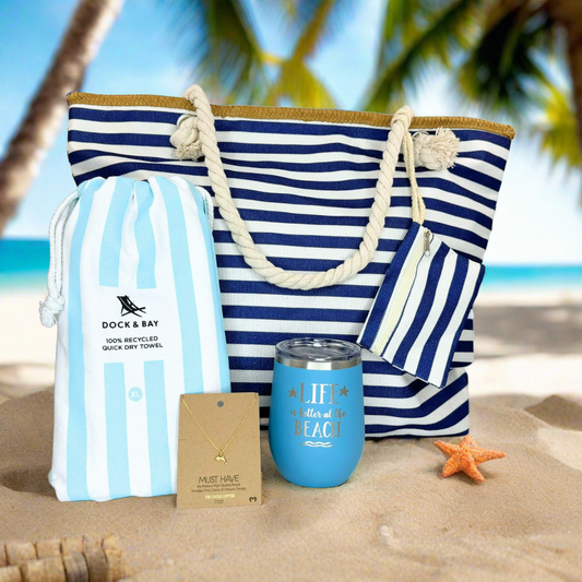 Complete Beach Lover Gift Set with a striped beach bag, dainty dolphin necklace, sand-free towel, and an engraved "Life is Better at the Beach" wine tumbler