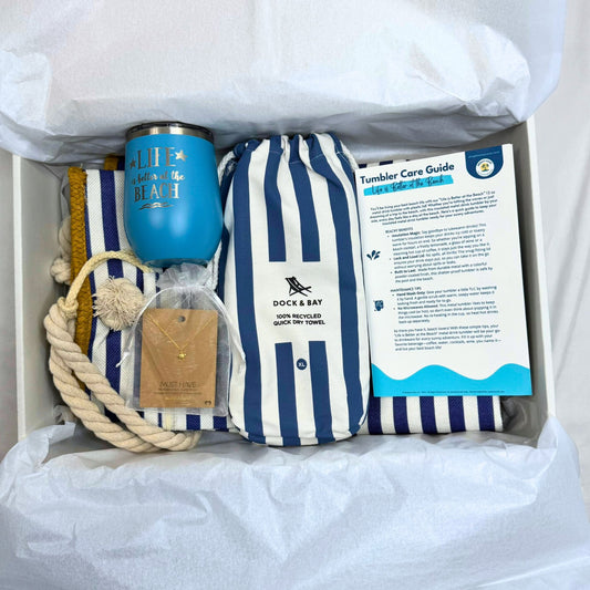 Navy Nautical Beach Lover Gift Set with striped towel, ocean blue tumbler, gold sea turtle necklace, and printed bonus cards in gift box.