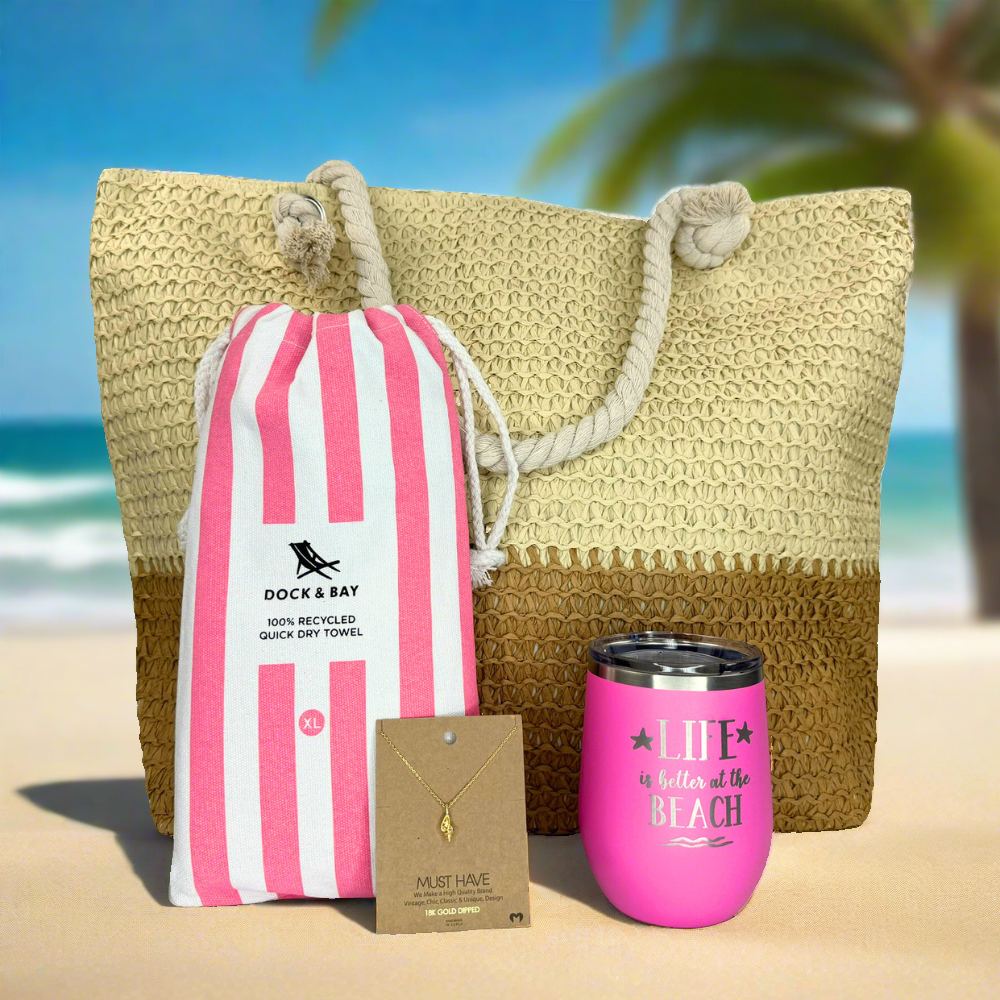 Complete Beach Lover Gift Set with beige and tan straw beach tote, gold conch shell pendant, extra-large quick-dry towel, and insulated 'Life is Better at the Beach' tumbler.