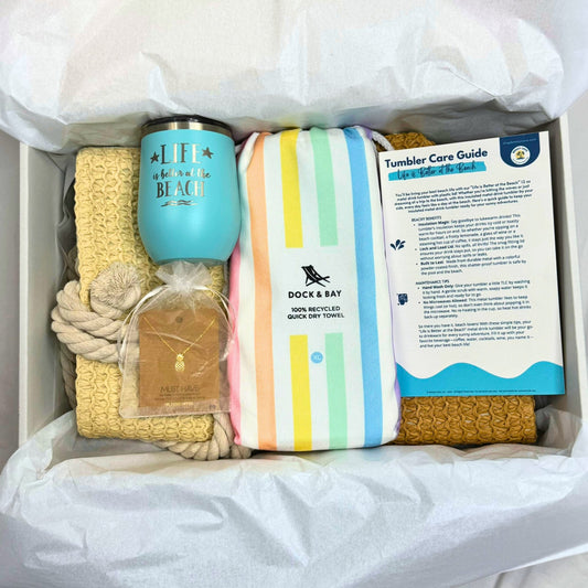 Pastel Beach Lover Gift Set with straw beach bag, pastel striped towel, teal tumbler, gold pineapple necklace, and bonuses in gift box.