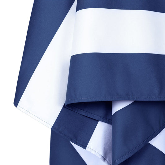Close up of blue and white striped microfiber beach towel fabric and hem