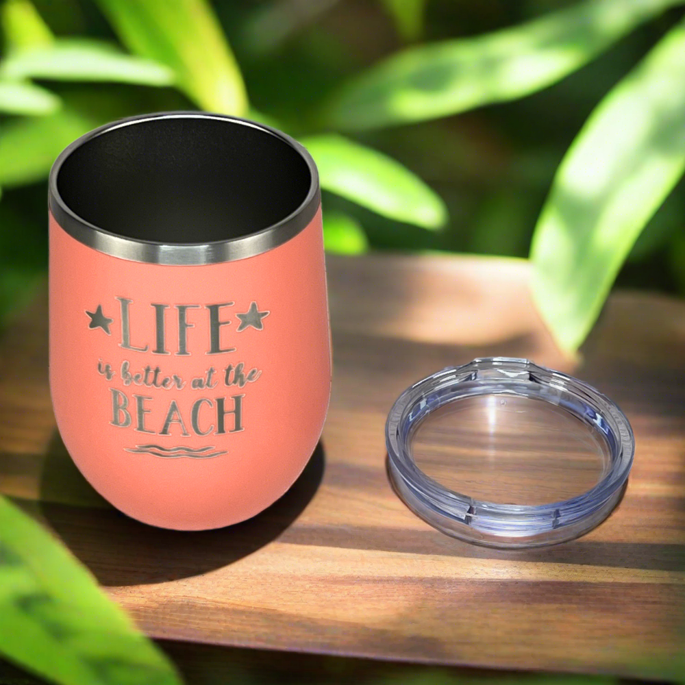 View of the peach drink tumbler, showcasing the lid and sleek insulated design for hot and cold drinks