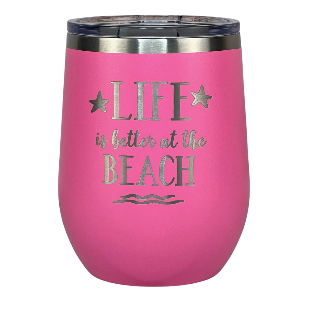 Close-up of pink "Life is Better at the Beach" engraved tumbler with lid