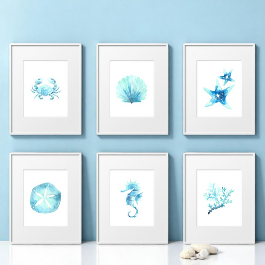 Set of 6 framed 8x10 watercolor beach art prints arranged on a soft blue background. Includes seashell, sea horse, coral, sand dollar, starfish, and crab designs.