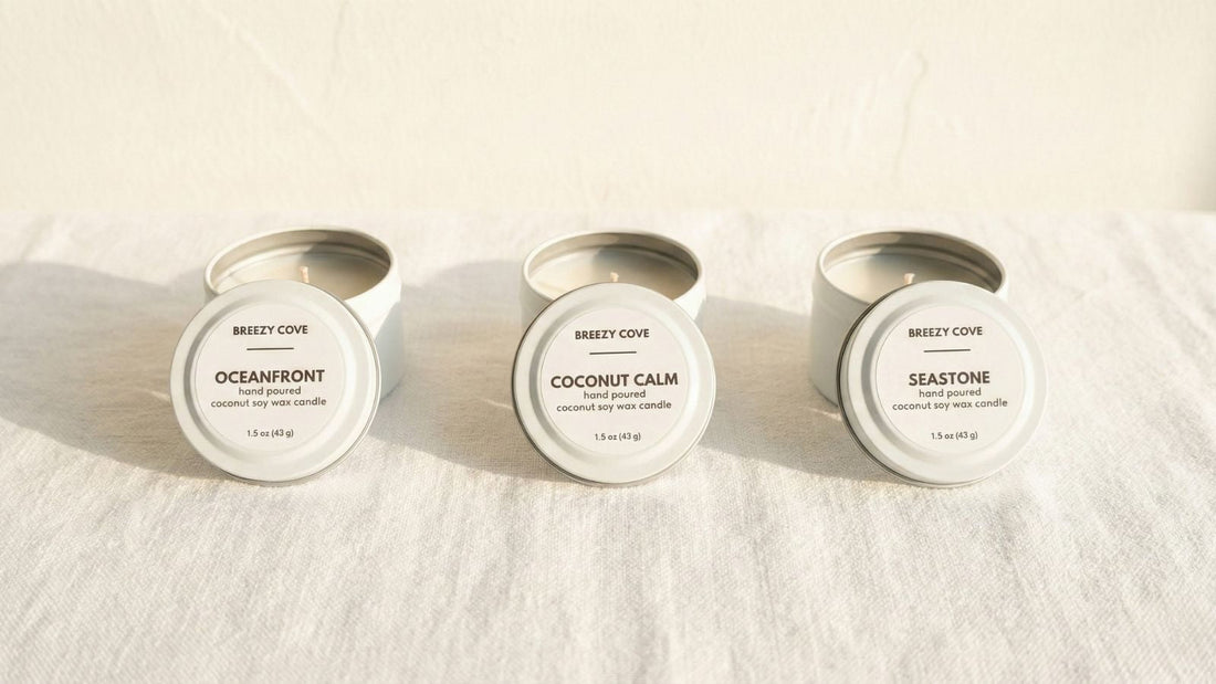 Breezy Cove nontoxic beach candles Oceanfront, Coconut Calm, and Seastone shown in soft coastal light.