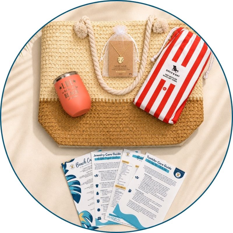 Coral beach bag gift set flat lay with straw beach bag, coral striped towel, peach tumbler, gold-dipped monstera necklace and printed bonus cards.