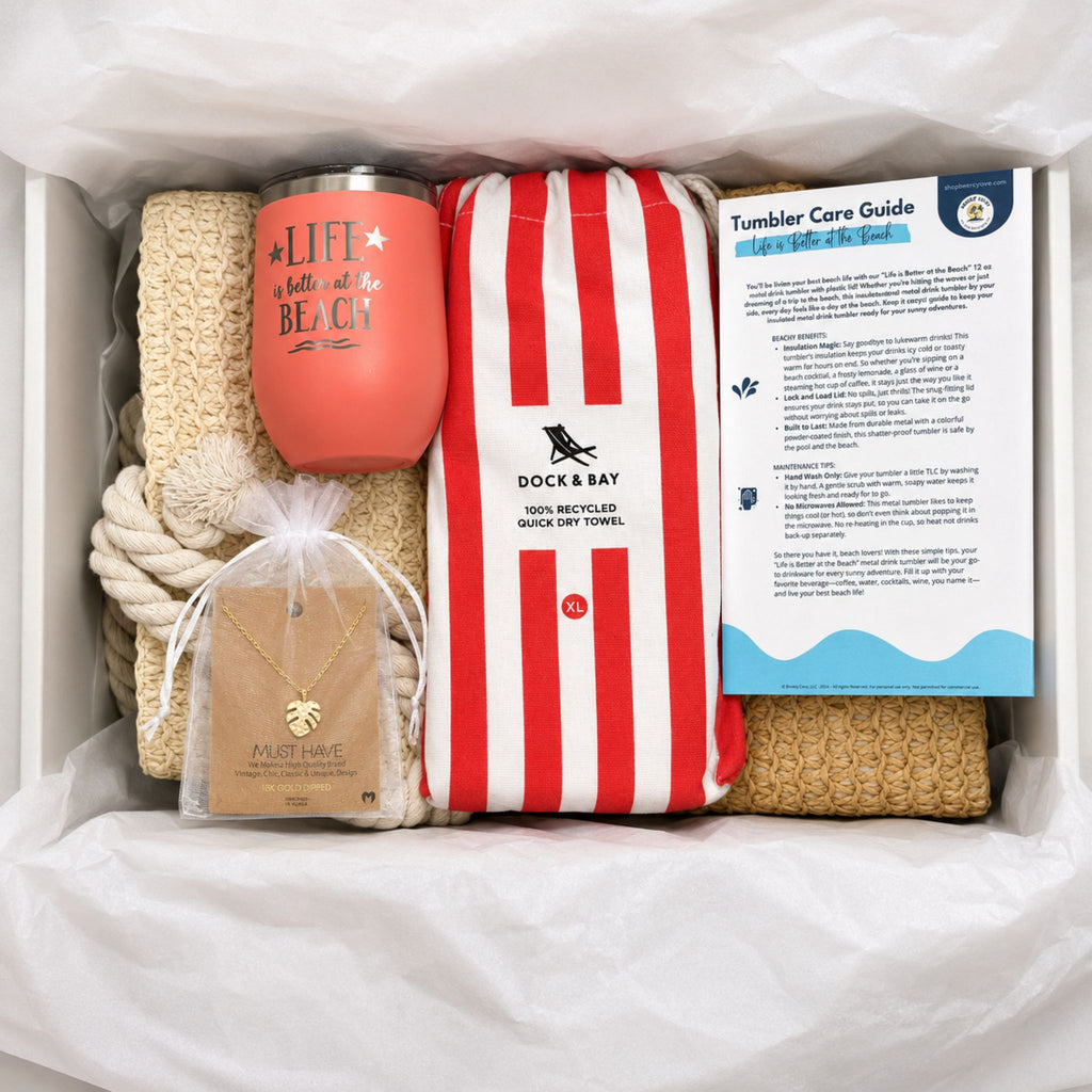 Beach gifts for women arranged in a gift box with straw beach bag, striped towel, peach tumbler, monstera necklace and bonus cards.