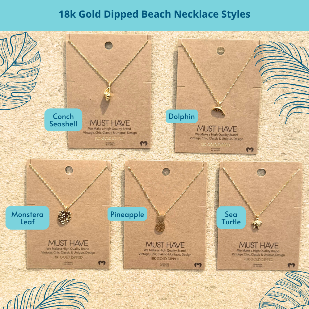 Five 18k gold-dipped beach-themed pendant necklaces, including dolphin, pineapple, conch shell, sea turtle, and monstera leaf, displayed together on a flat surface, showcasing the variety of coastal-inspired designs