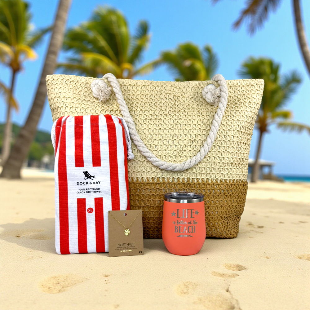 beach lover gift set in coral, in a resort setting on a sandy beach