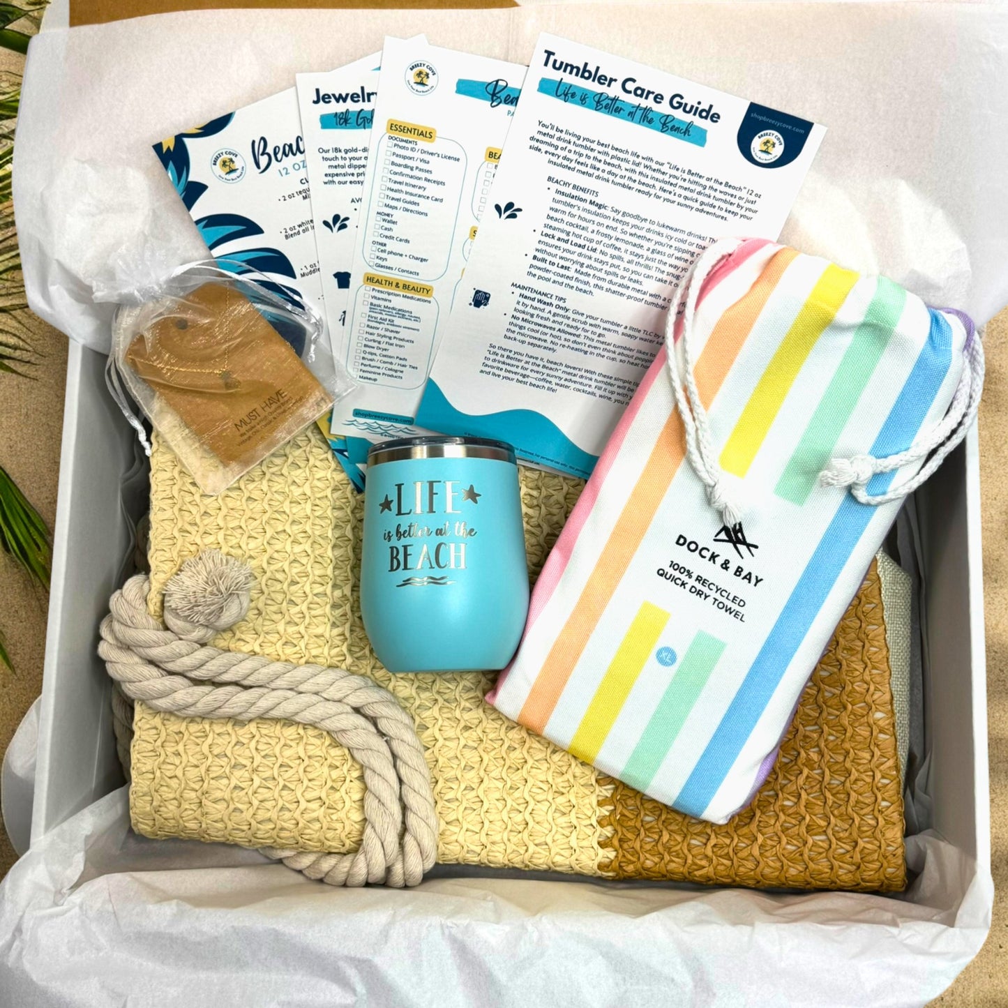 Pastel Beach Lover Gift Set with straw beach bag, pastel rainbow towel, teal tumbler, gold pineapple necklace, and printed bonus cards in gift box.