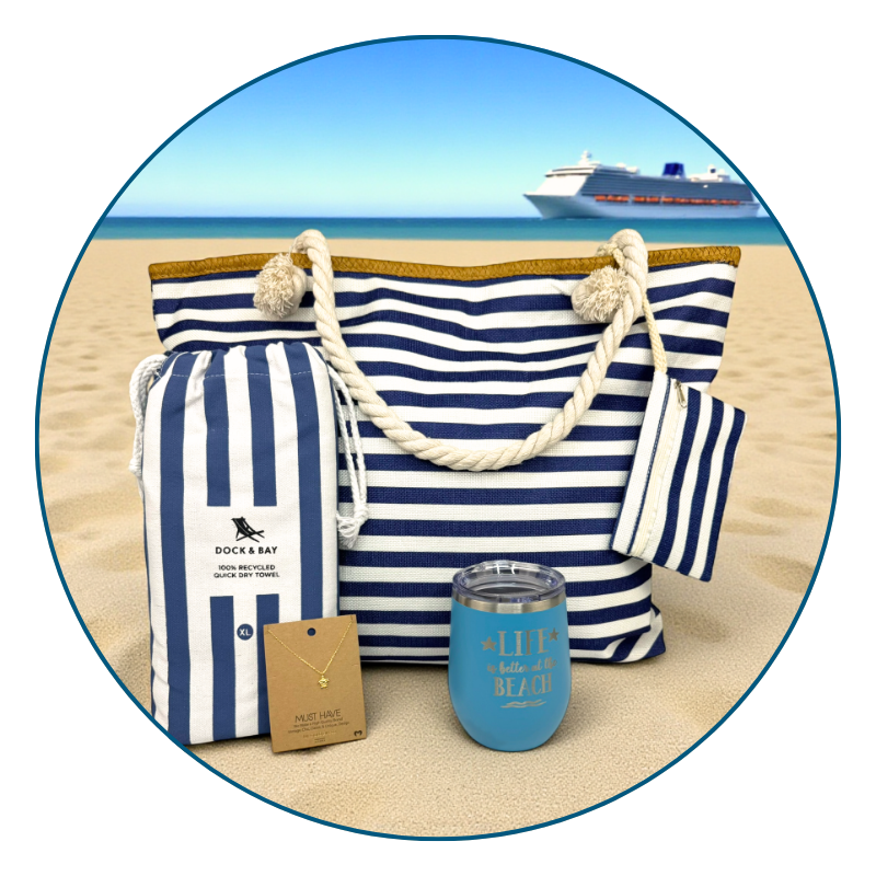 nautical beach lover gift set in with towel, tumbler, bag, and sea turtle necklace on sandy beach with cruise ship in the background