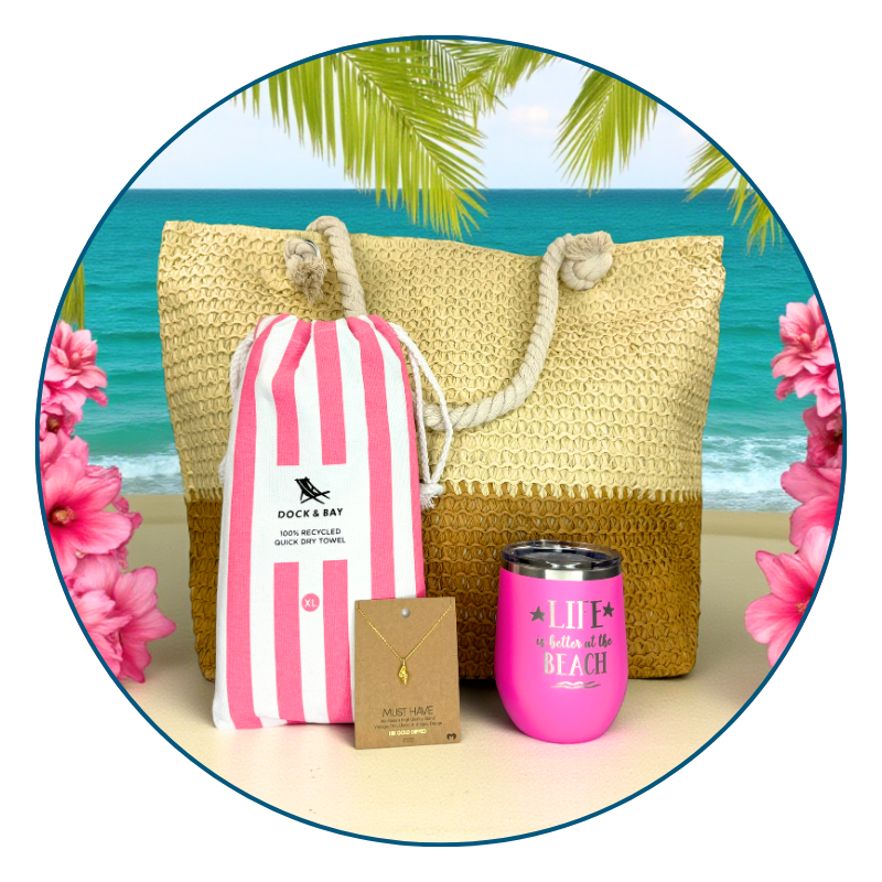 pink beach lover gift set in tropical beach setting with pink flowers, includes towel, tumbler, beach bag, and conch shell necklace.