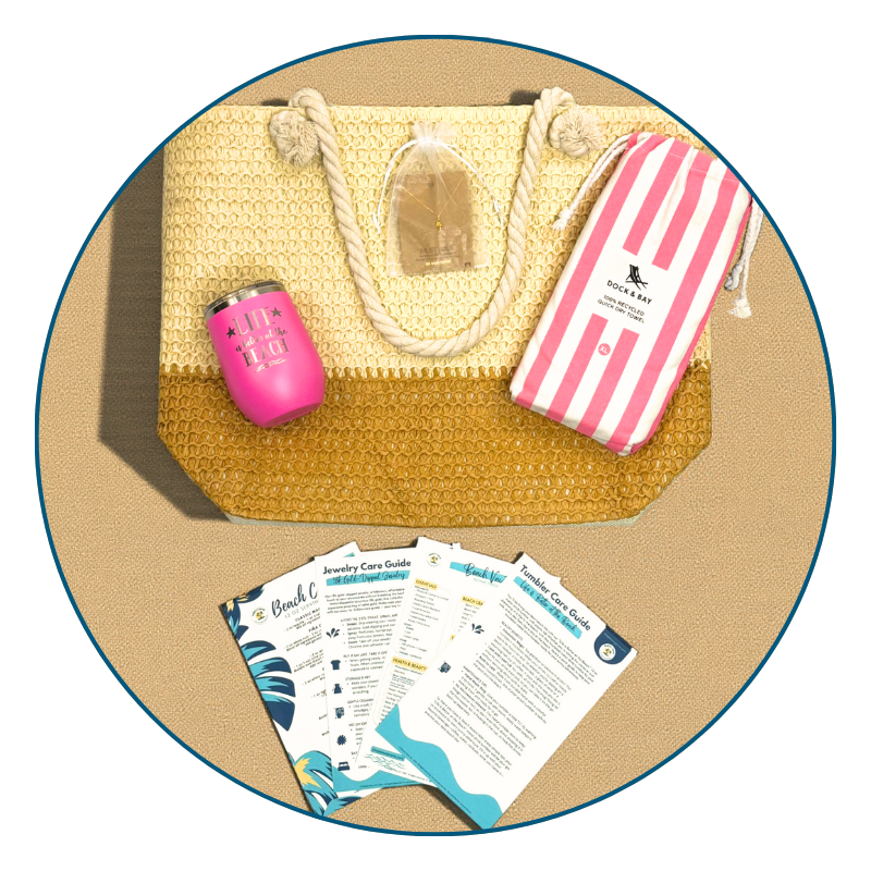 Flat lay of Pink Beach Lover Gift Set with straw beach bag, pink striped towel, pink tumbler, gold conch shell necklace, and printed bonus cards.