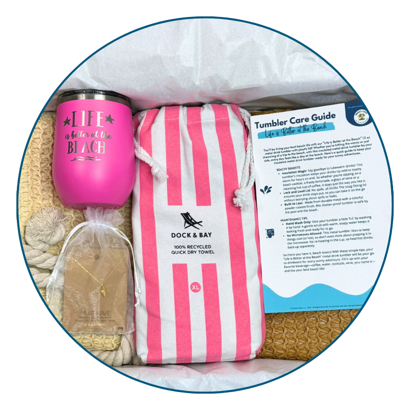 Pink Beach Lover Gift Set with pink striped towel, pink tumbler, gold conch shell necklace, and printed bonus cards arranged in Breezy Cove gift box.