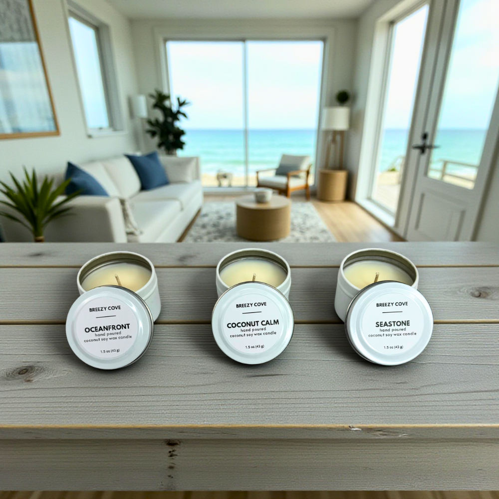 Oceanfront, Coconut Calm, and Seastone mini candles displayed in a bright beach house with an ocean view.