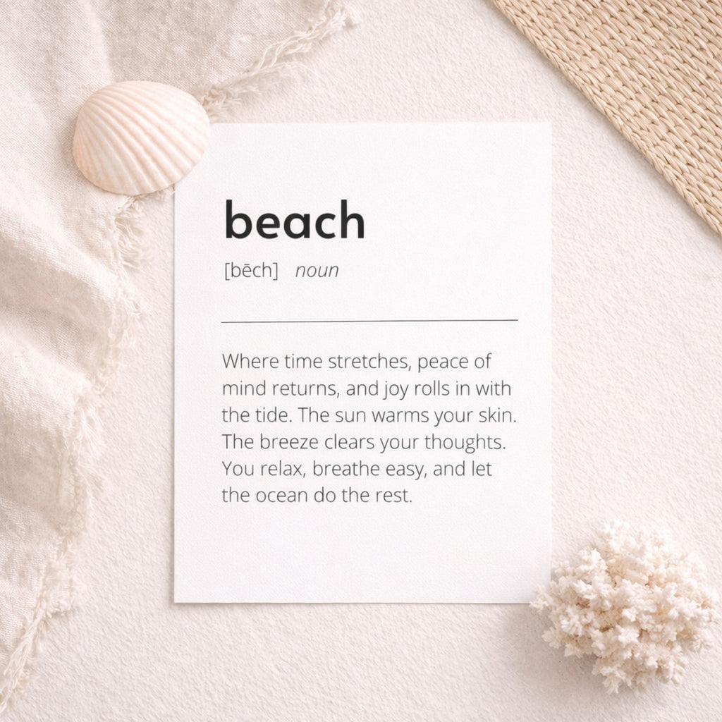 Beach definition art print flat lay on soft neutral fabric with seashell and woven mat