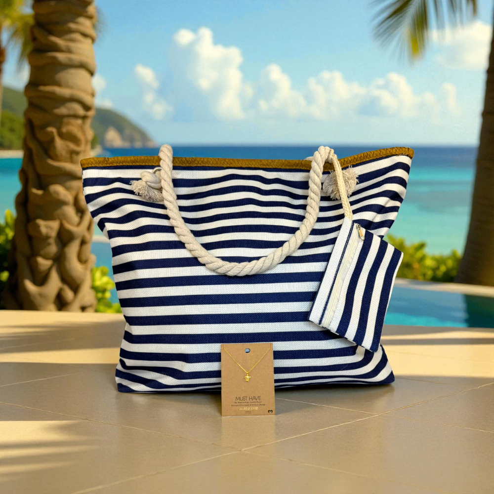 Navy striped beach bag with gold sea turtle necklace displayed on a sunlit patio table — effortless coastal style bundle for women who love the beach.