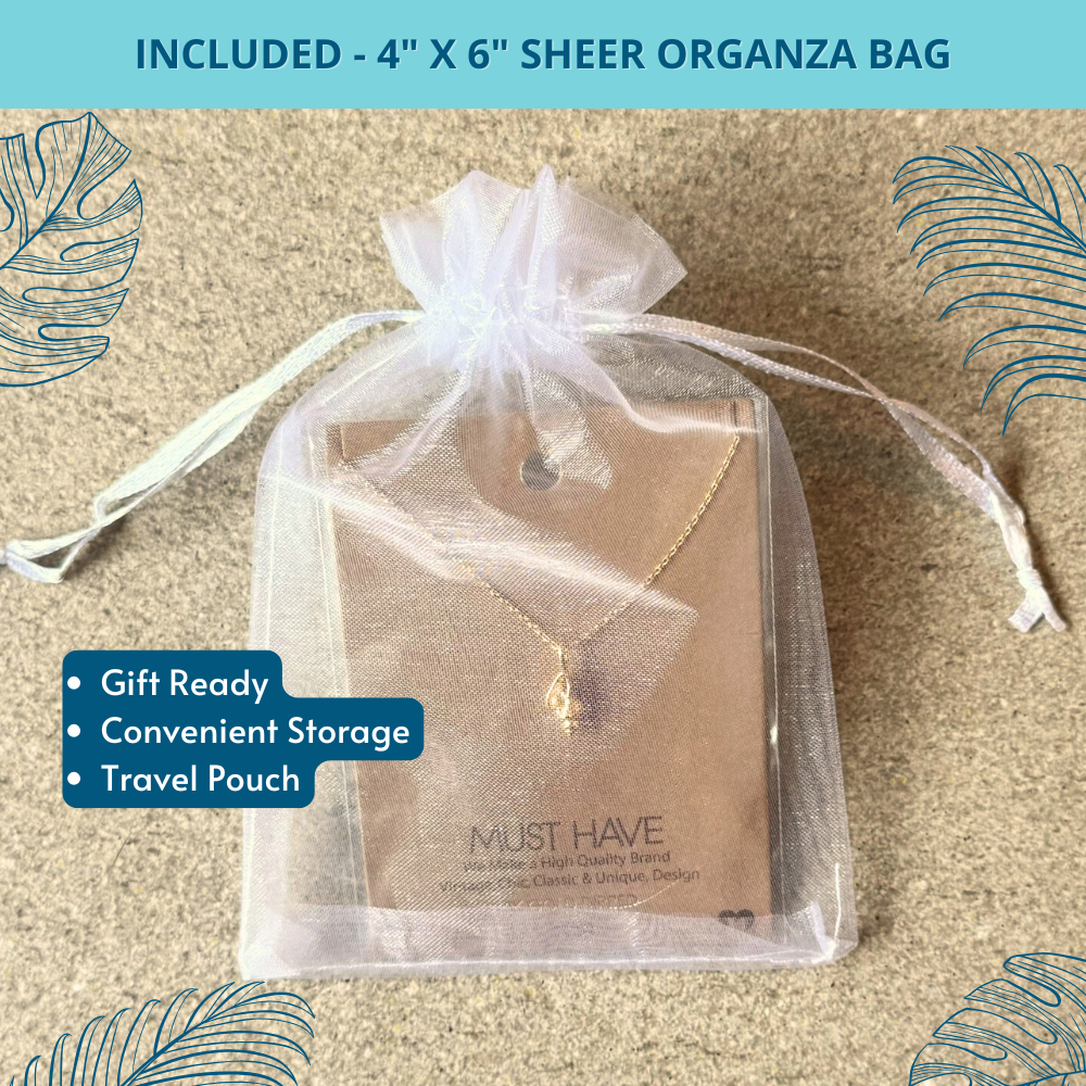18k gold dipped conch shell pendant necklace, delicately wrapped in a white 4" x 6" organza bag, ideal for gifting or storage
