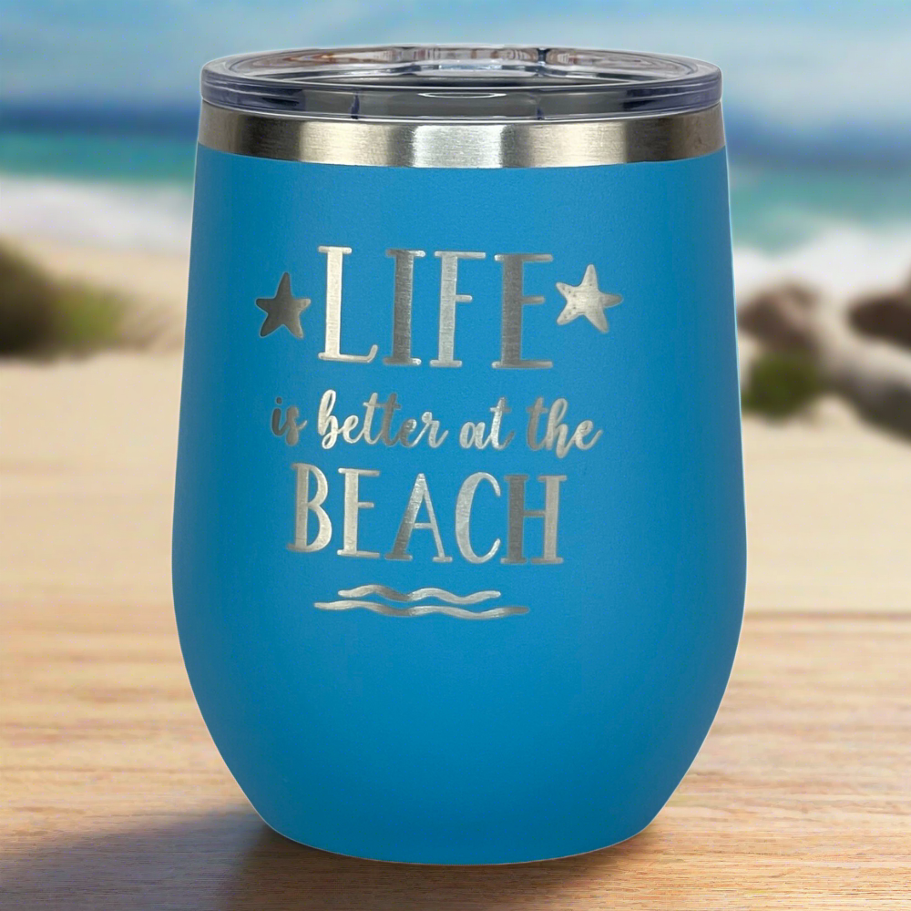 ocean blue, engraved, "Life is better at the beach" metal drinks tumbler with lid is perfect for keeping drinks hot or cold