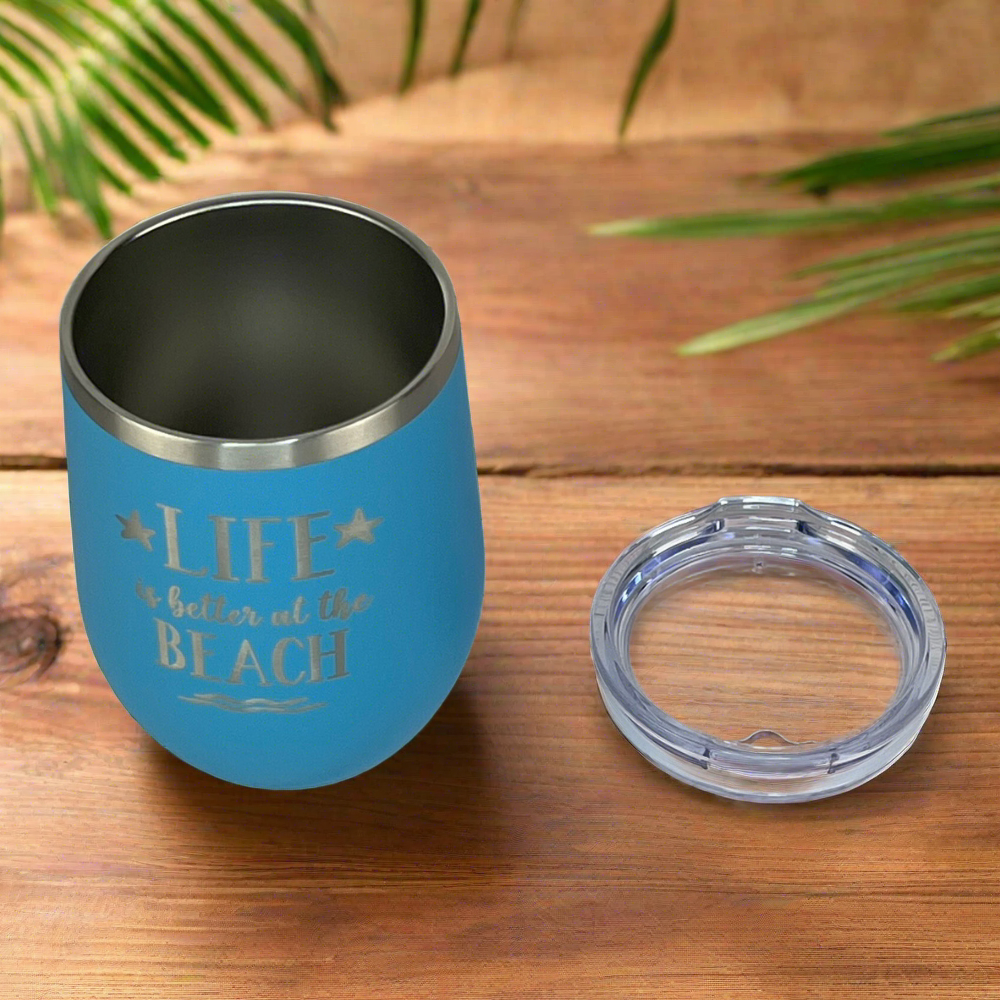 ocean blue, engraved, "Life is better at the beach" metal drink tumbler with lid is perfect for keeping drinks hot or cold