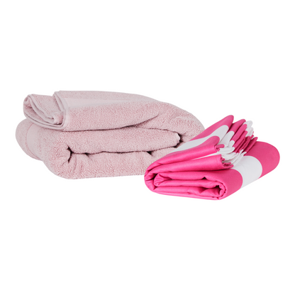 bright hot pink and white striped quick dry Dock and Bay extra large beach towel folded compactly comparing to a standard bulky beach towel