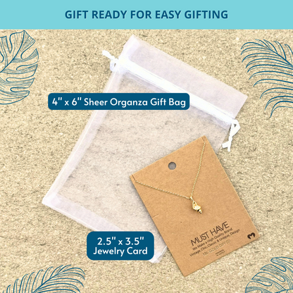 Exquisite 18k gold-dipped conch shell pendant necklace presented in a white organza gift bag, perfect for a beach lover's accessory