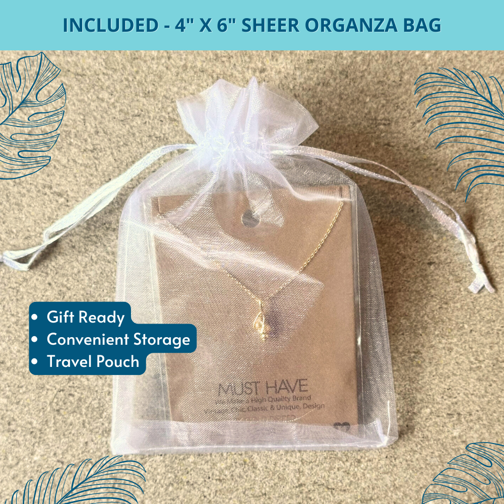 Charming conch shell pendant necklace, delicately wrapped in a white 4" x 6" organza bag, ideal for gifting or storage