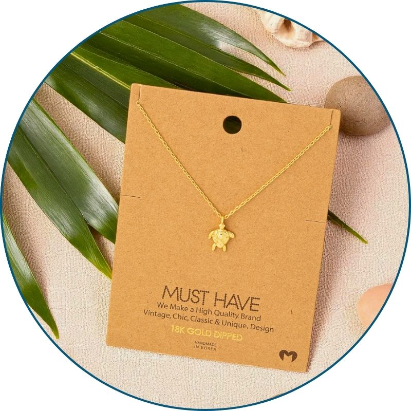 Gold sea turtle necklace on jewelry card with white organza gift bag — 18k gold dipped beach necklace ready to gift