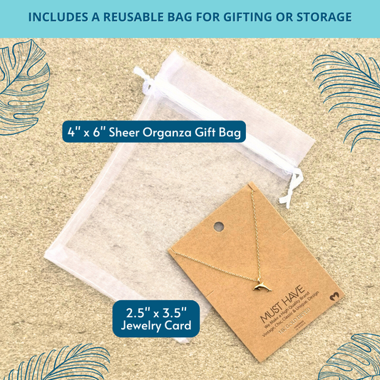 18k gold dipped monstera leaf necklace shown with white organza bag – includes reusable bag for gifting or everyday storage