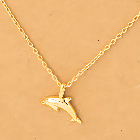 Detailed close-up of the 18k gold-dipped dolphin pendant necklace, highlighting its sleek design and shimmering finish