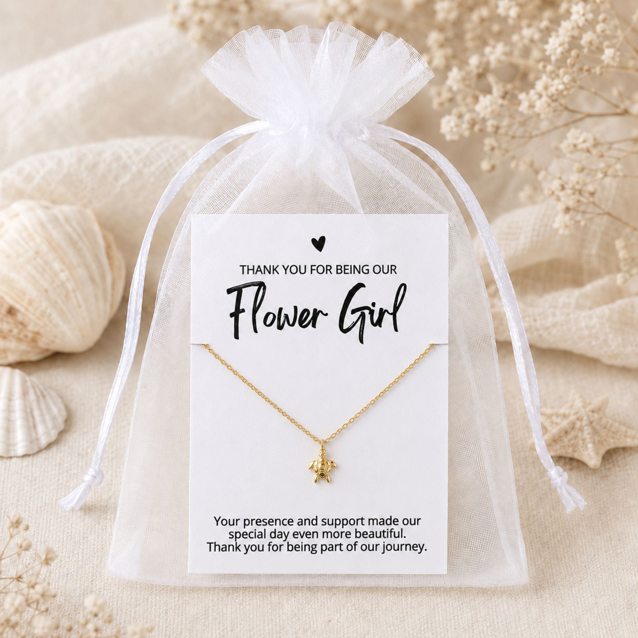 Flower Girl sea turtle necklace gift packaged in a white organza bag for a beach wedding