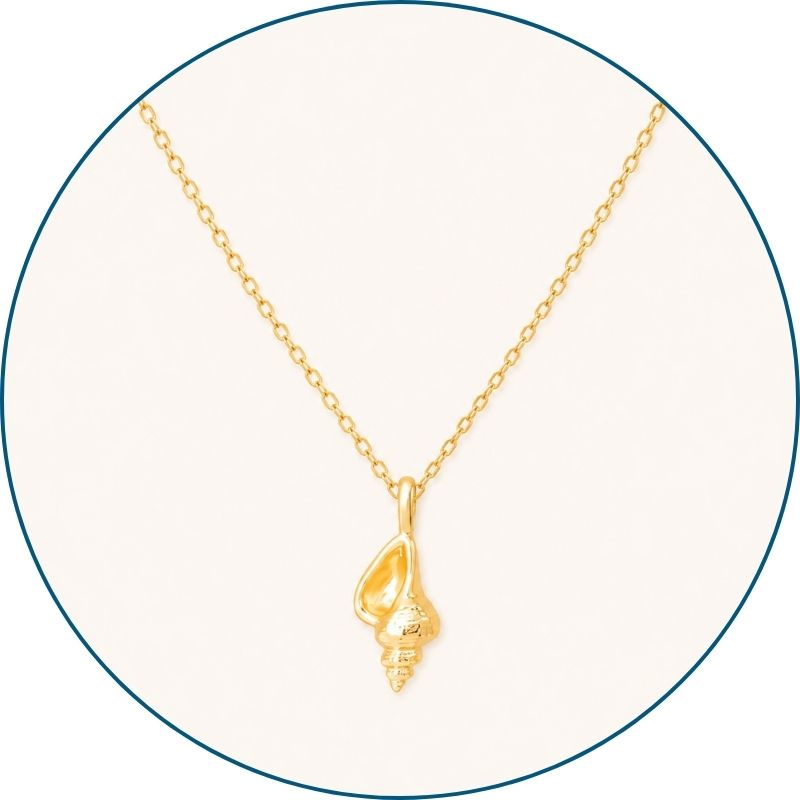 Close-up of gold conch shell necklace pendant and chain — 18k gold dipped conch shell jewelry for women