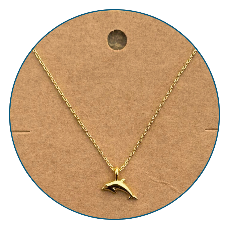 Close-up of 18k gold dipped dolphin necklace pendant with bright polished finish and golden shine.