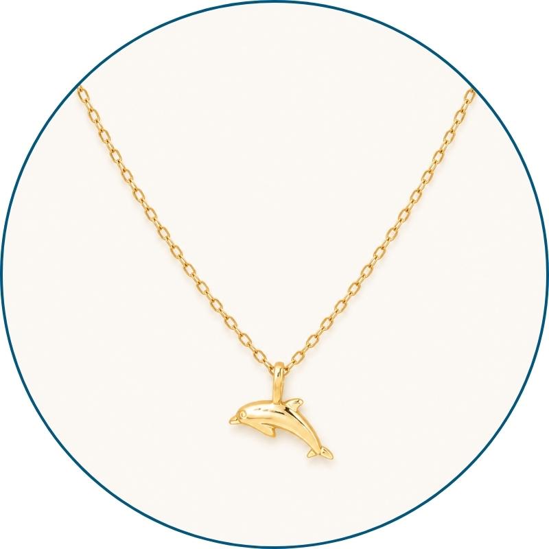 Close-up of gold dolphin necklace pendant and chain — 18k gold dipped dolphin jewelry for women