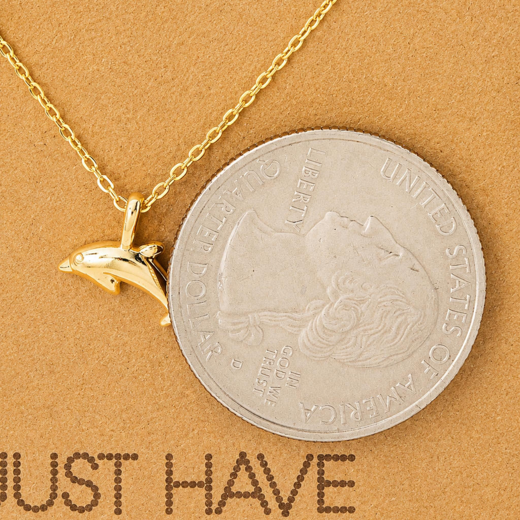 Dainty gold dolphin pendant necklace on a jewelry card — 18k gold dipped dolphin necklace for beach lovers