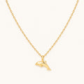 Gold dolphin pendant necklace on a 16-inch chain — 18k gold dipped dolphin jewelry on white background