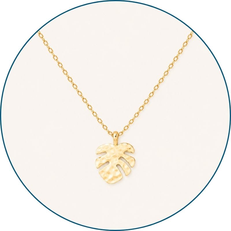 Close-up of gold monstera necklace pendant and chain — 18k gold dipped tropical monstera jewelry for women