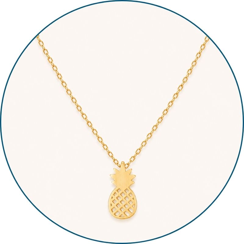Close-up of gold pineapple necklace pendant and chain — 18k gold dipped tropical pineapple jewelry for women
