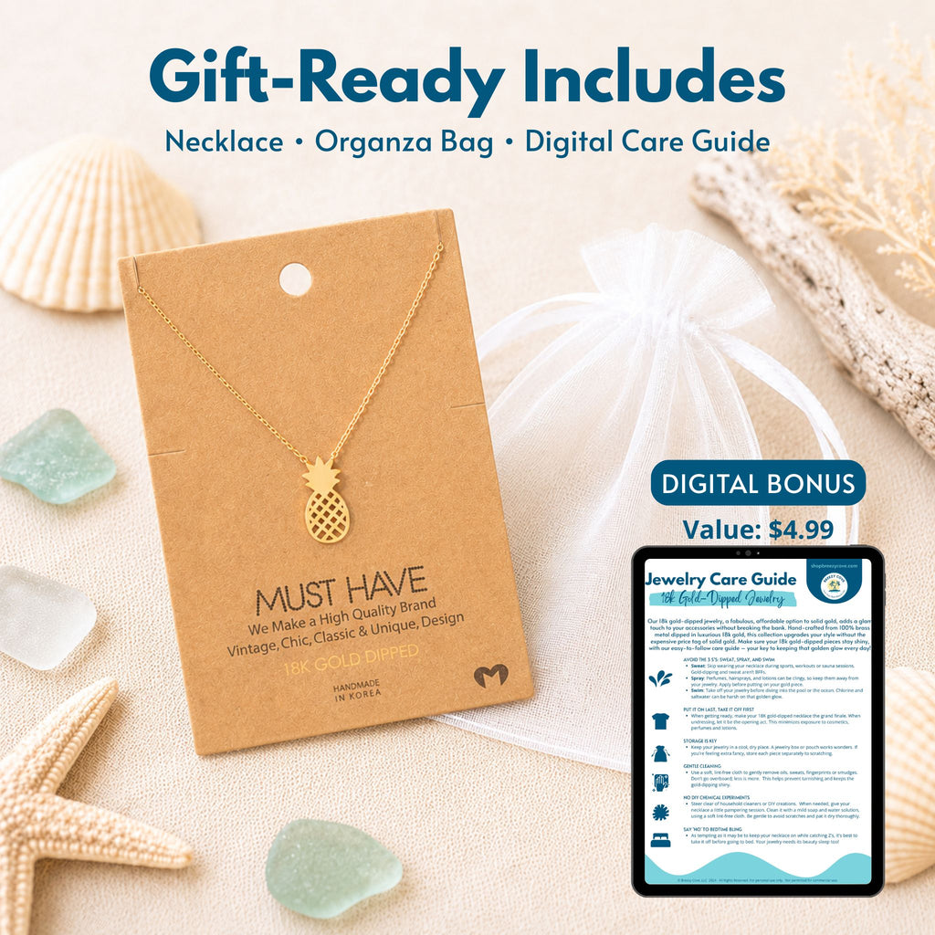Gold pineapple necklace gift set — includes 18k gold dipped pineapple necklace on jewelry card, white organza bag, and digital jewelry care guide
