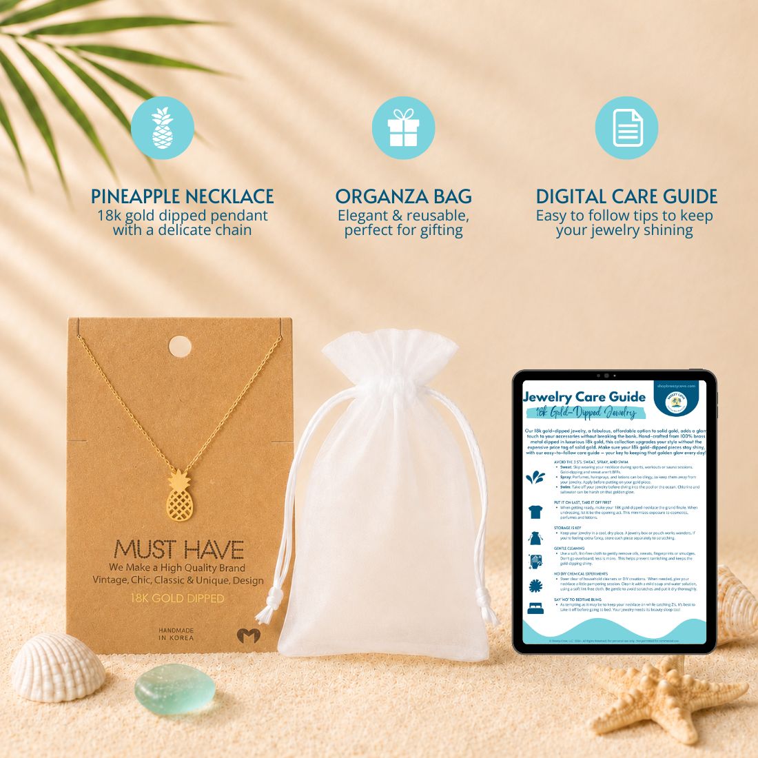 What's included with the gold pineapple necklace — 18k gold dipped pineapple necklace on jewelry card, white organza gift bag, and digital jewelry care guide
