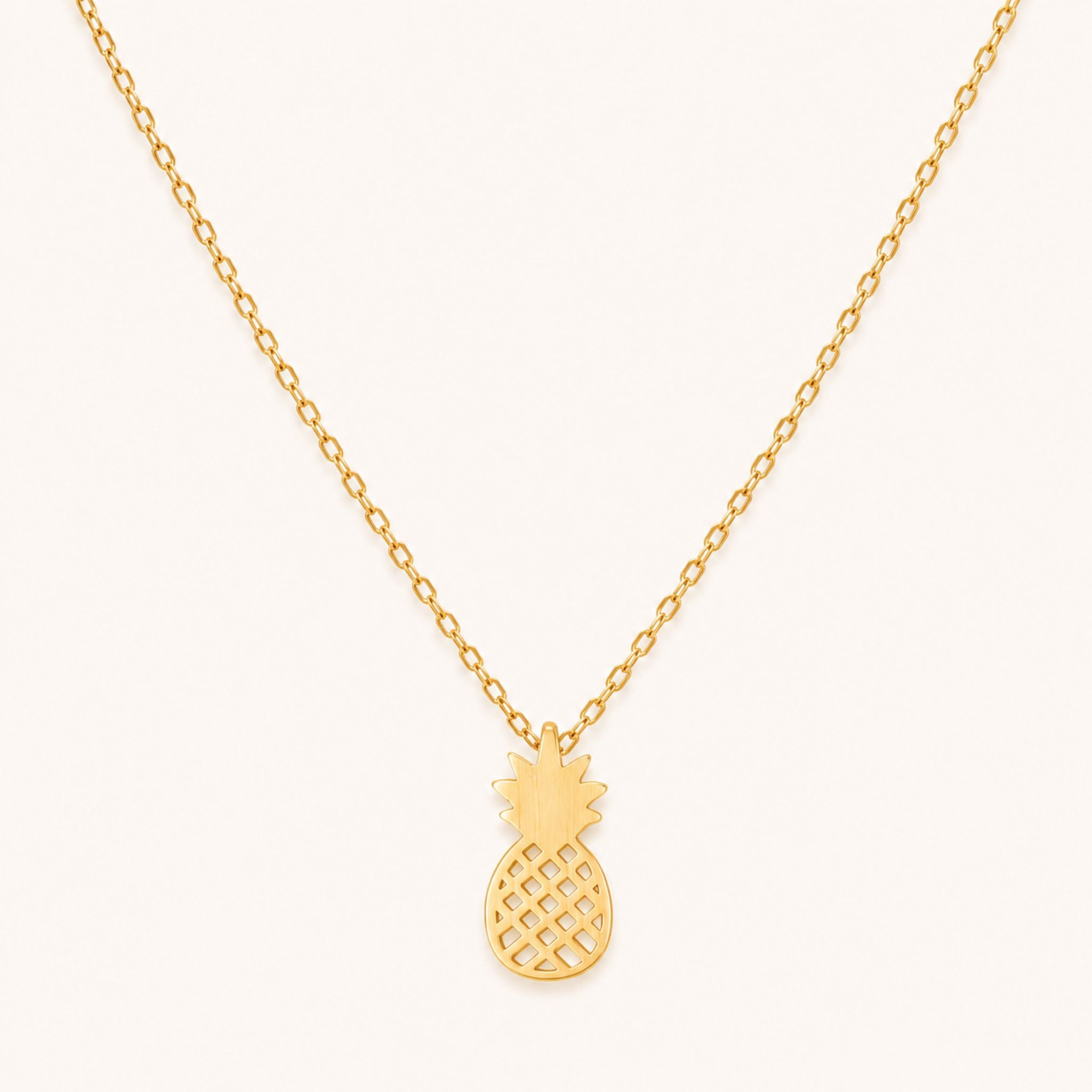 Gold pineapple pendant necklace on a 16-inch chain — 18k gold dipped pineapple jewelry on white background
