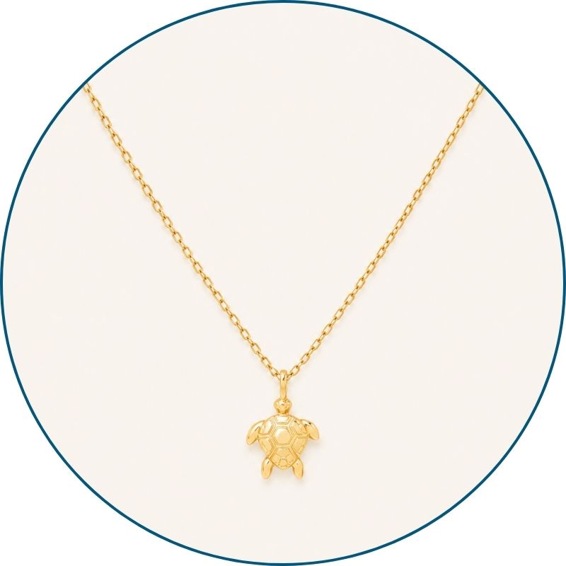 Close-up of gold sea turtle necklace pendant and chain — 18k gold dipped sea turtle jewelry for women