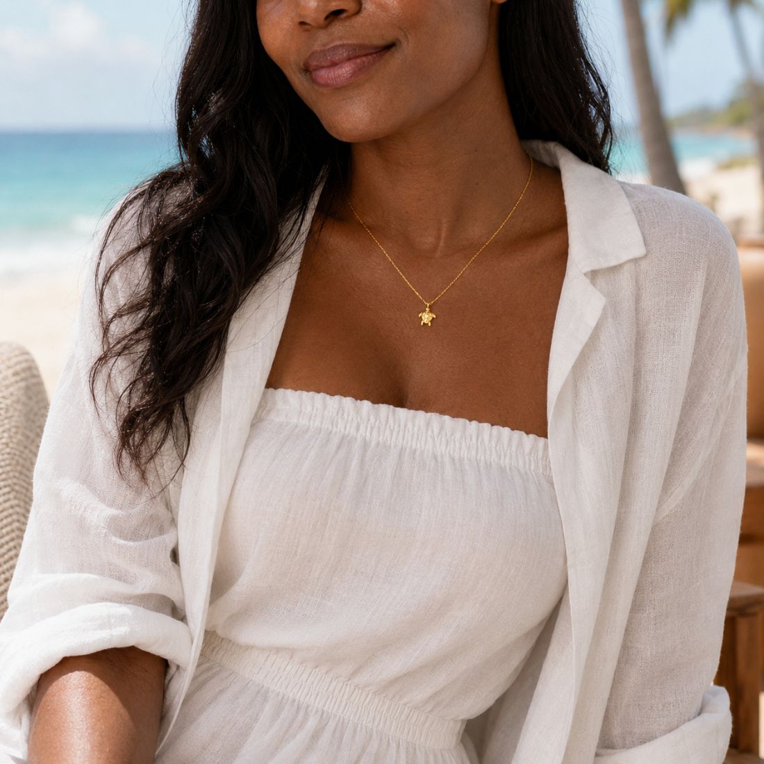 Woman wearing a dainty gold sea turtle necklace for everyday wear — 18k gold dipped beach necklace for women