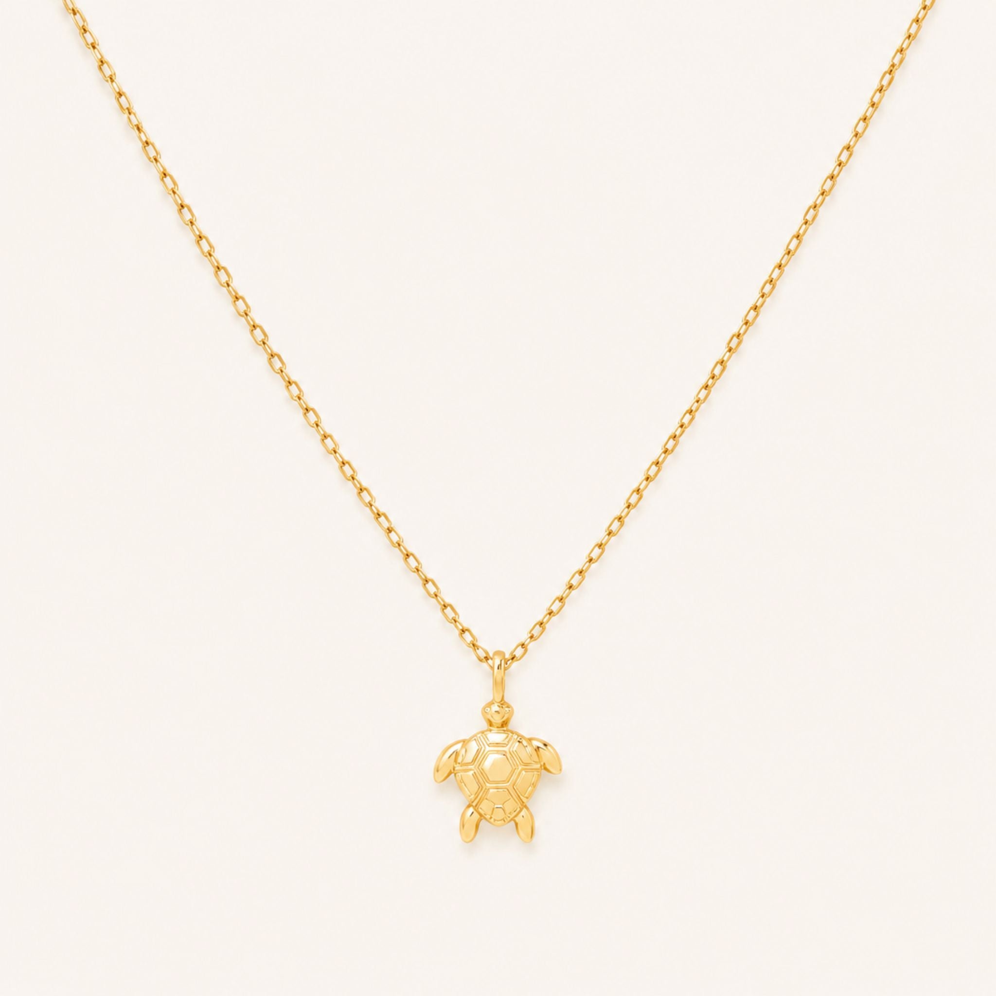 Gold sea turtle pendant necklace on a 16-inch chain — 18k gold dipped sea turtle jewelry on white background