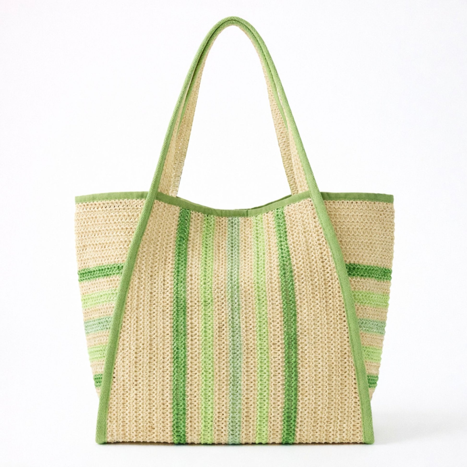 Green striped straw beach bag tote with green trim and shoulder straps on a white background.