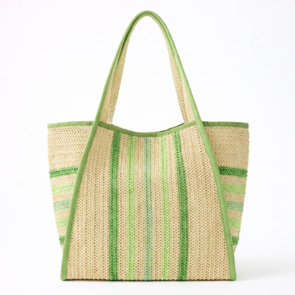 Green striped straw beach bag tote with green trim and shoulder straps on a white background.