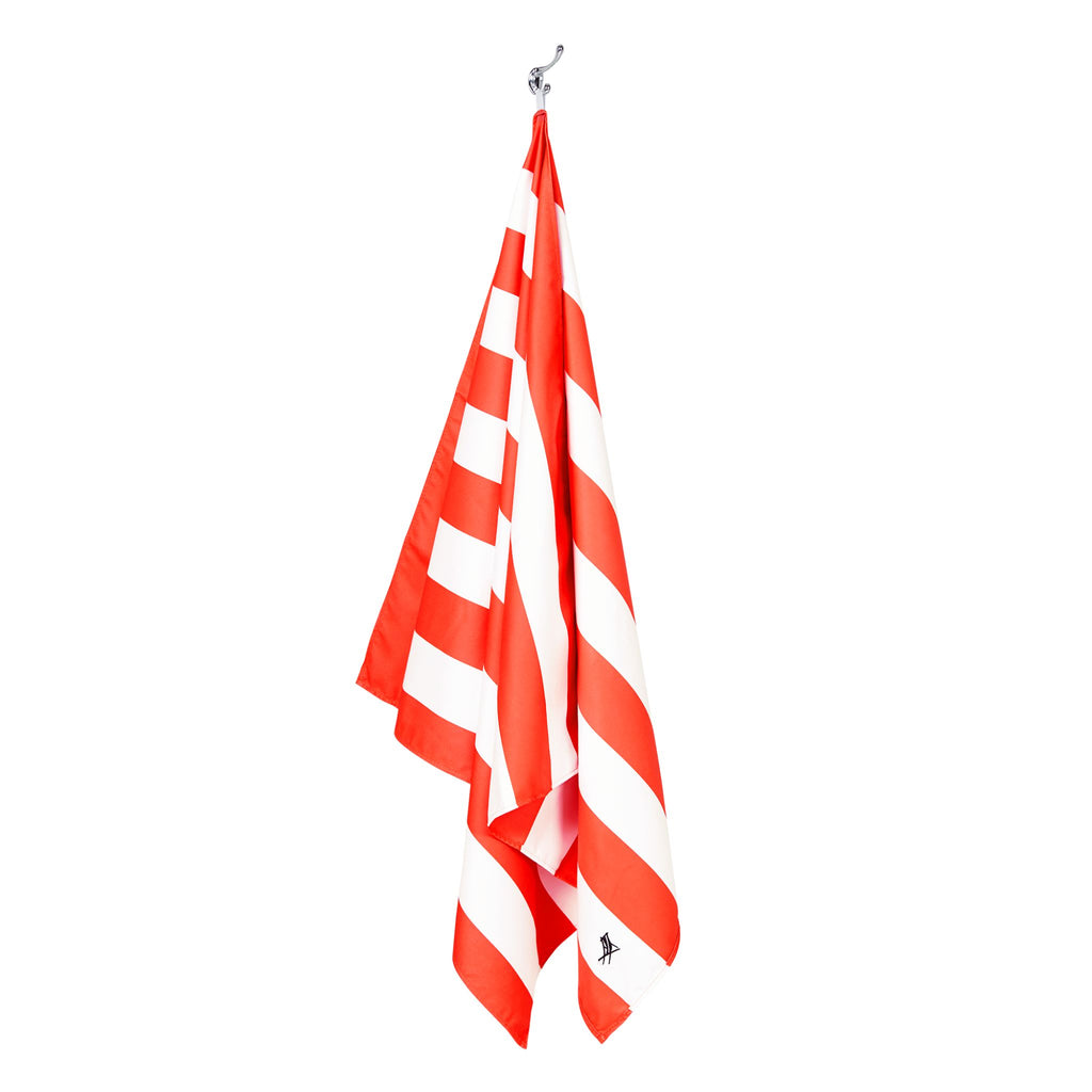 Hanging coral striped extra large beach towel made with quick dry microfiber fabric