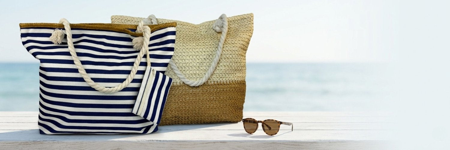 Quality beach bags under $50: navy striped tote and straw beach bag tote by the ocean, fast shipping available.