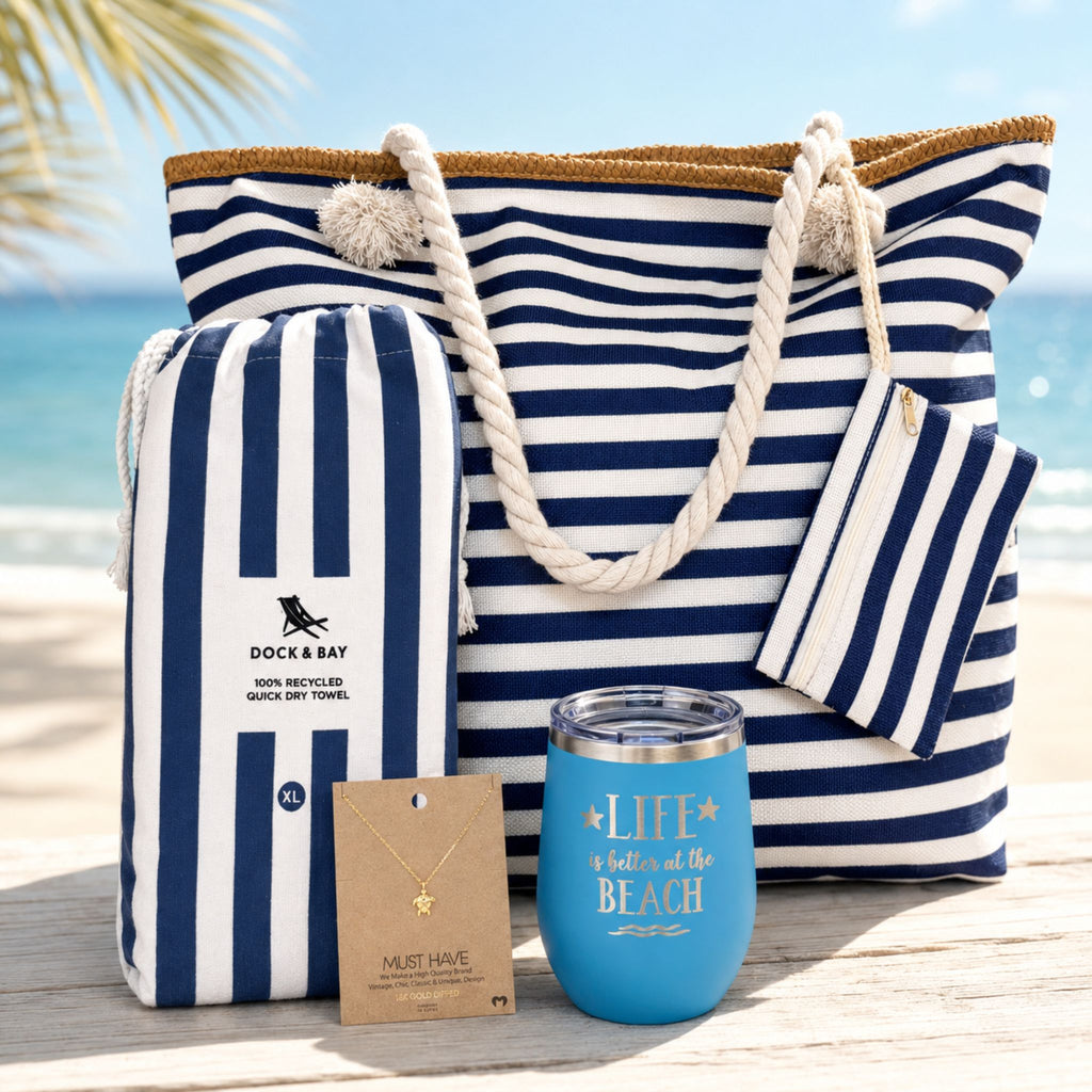 Navy beach bag gift set with blue and white striped beach bag, quick dry towel, ocean blue tumbler, and sea turtle necklace, designed as a beach gift for women and beach lovers.